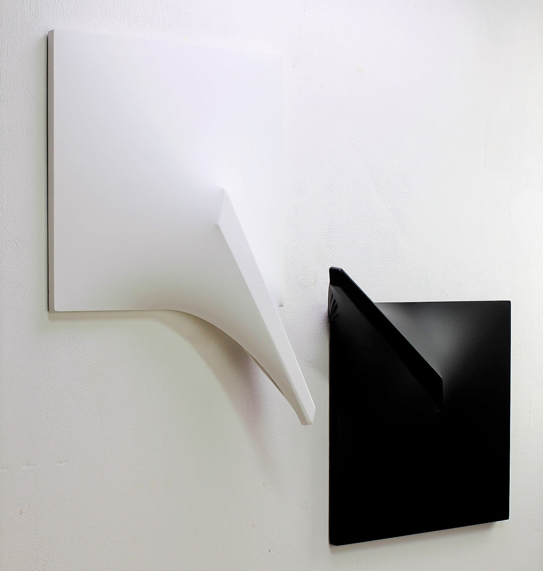 Diptych Italian style Extroflexion. The white specimen measures cm. 57x40, height 16. The black specimen measures cm. 46x52, height 18. 